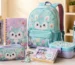 Character stationery, backpack, lunch box, craft kit, and accessories arranged as a licensed merchandise school collection.